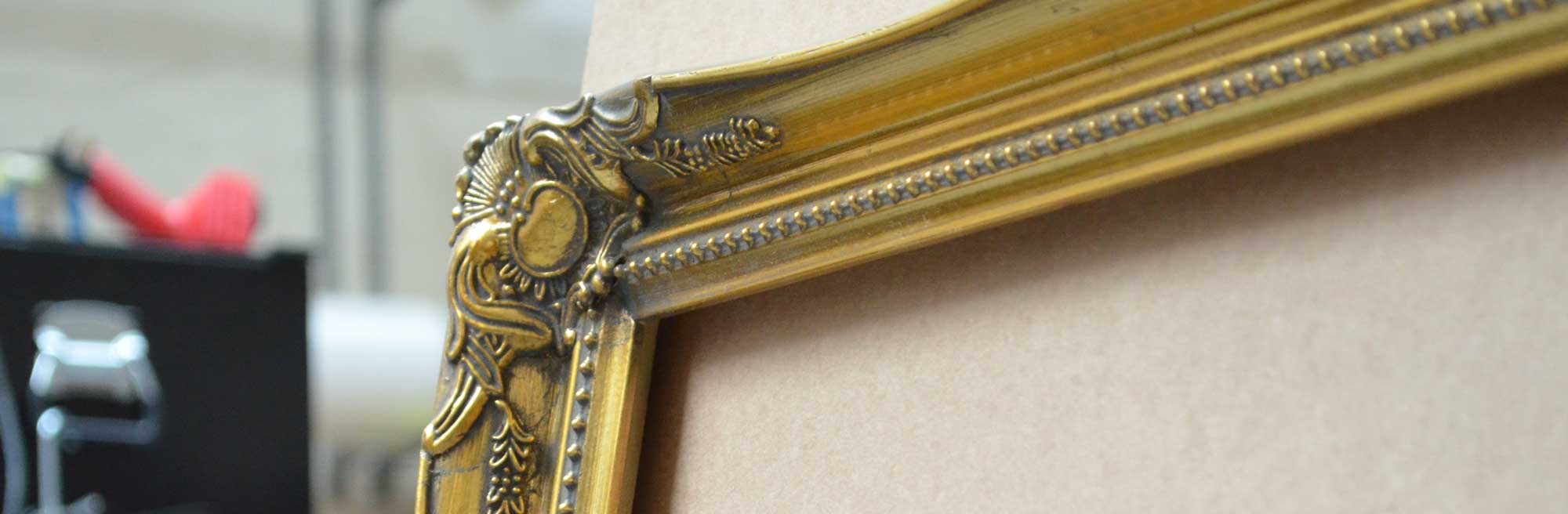 An example of a gold ornate picture frame